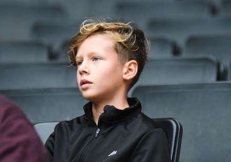 MILTON KEYNES, ENGLAND - SEPTEMBER 25, 2021: A young spectator pictured in the stands ahead of the...