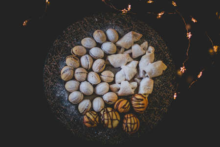 Moody picture of traditional Christmas bakeries on a place with bokeh effect and cozy atmosphere.の写真素材