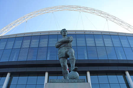 MANCHESTER, ENGLAND - SEPTEMBER 14, 2016: Bobby Moore statue outside Wembley Stadium pictured prior...