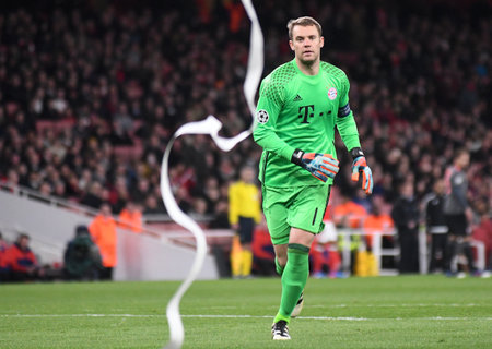 LONDON, ENGLAND - MARCH 7, 2017: Manuel Neuer cleans the pitch after Bayern ultras thrown paper rolls during the second leg of the UEFA Champions League Round of 16 game between Arsenal FC and Bayern Munchen at Emirates Stadium. Copyright: Cosmin Iftode/Pのeditorial素材