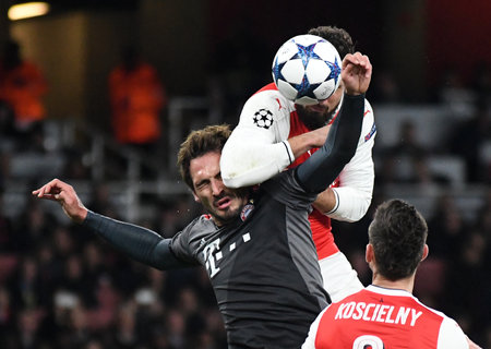 LONDON, ENGLAND - MARCH 7, 2017: Mats Hummels (L) of Bayern and Olivier Giroud (R) of Arsenal pictured in action during the second leg of the UEFA Champions League Round of 16 game between Arsenal FC and Bayern Munchen at Emirates Stadium. Copyright: Cosmのeditorial素材