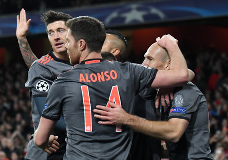 LONDON, ENGLAND - MARCH 7, 2017: Xabi Alonso (L) congratulates Arjen Robben of Bayern after he scored a goal during the second leg of the UEFA Champions League Round of 16 game between Arsenal FC and Bayern Munchen at Emirates Stadium. Copyright: Cosmin Iのeditorial素材