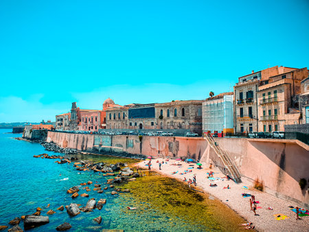View of the beach and the surrounding blocks of flats in Syracuse, Italy, during summer.の写真素材