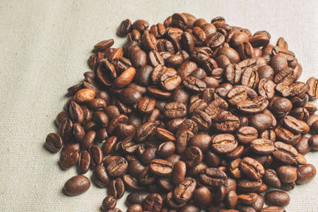 coffee grains pile on the tableの写真素材