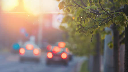 Beautiful sunset city bokeh. Blurred background photo.の写真素材