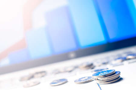 Online Money. coins on a laptopの写真素材