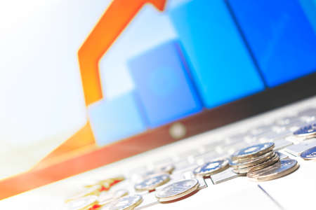 Online Money. coins on a laptopの写真素材
