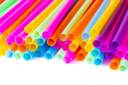 Colored plastic drinking straws on a white backgroundの写真素材
