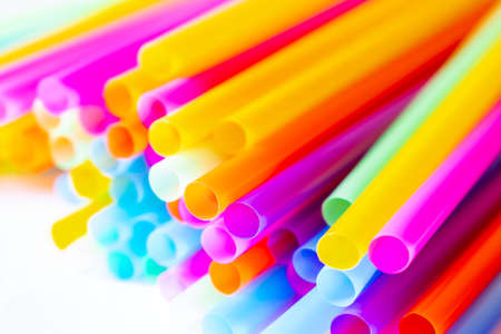 Colored plastic drinking straws on a white backgroundの写真素材