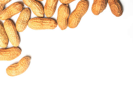 Pile of roasted peanuts on a white backgroundの写真素材