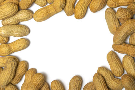 Pile of roasted peanuts on a white backgroundの写真素材