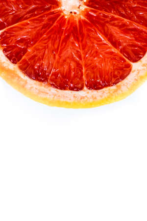 Pink ripe grapefruit slice on white isolated backgroundの写真素材