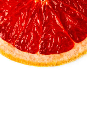 Pink ripe grapefruit slice on white isolated backgroundの写真素材