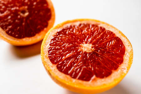 Pink ripe grapefruit slice on white isolated backgroundの写真素材