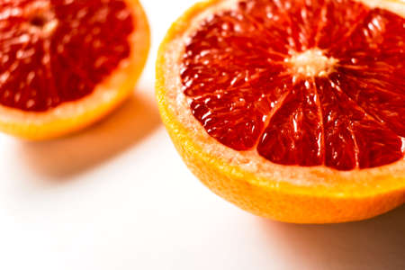 Pink ripe grapefruit slice on white isolated backgroundの写真素材
