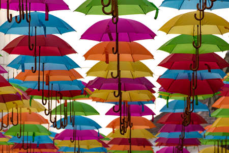 Colorful umbrellas background. Colorful umbrellas in the sky. Street decoration.の写真素材