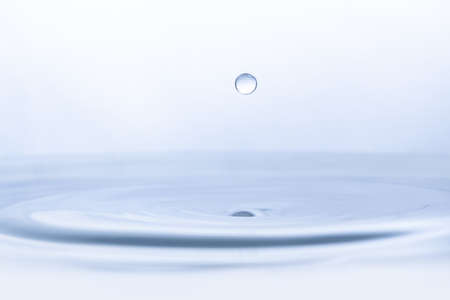 Water drop on water backgroundの写真素材