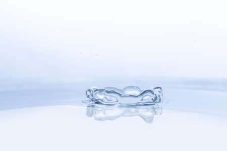 Water drop on water backgroundの写真素材