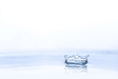 Water drop on water backgroundの写真素材
