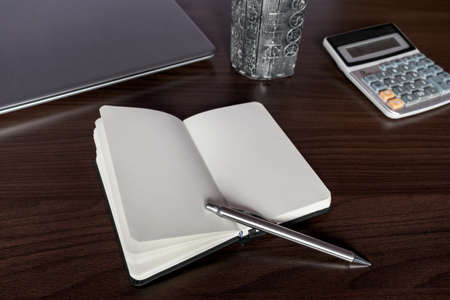 Notepad and lifestyle accessories on desk.の写真素材