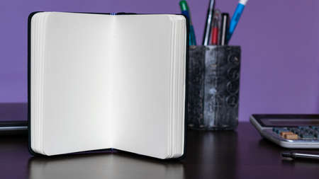 Notepad and lifestyle accessories on desk.の写真素材