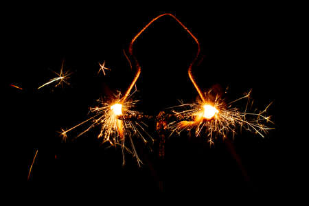 Fire sparklers on black background - Imageの写真素材