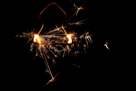 Fire sparklers on black background - Imageの写真素材