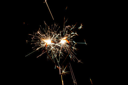 Fire sparklers on black background - Imageの写真素材