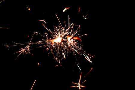 Fire sparklers on black background - Imageの写真素材