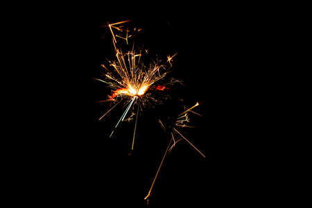 Fire sparklers on black background - Imageの写真素材