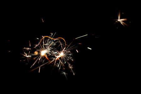 Fire sparklers on black background - Imageの写真素材