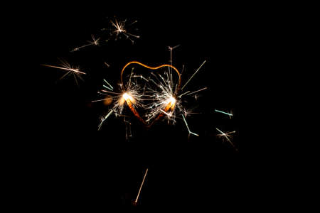 Fire sparklers on black background - Imageの写真素材