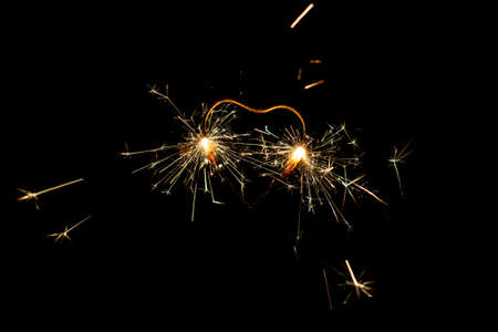 Fire sparklers on black background - Imageの写真素材