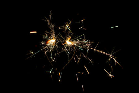 Fire sparklers on black background - Imageの写真素材
