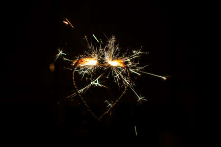 Fire sparklers on black background - Imageの写真素材