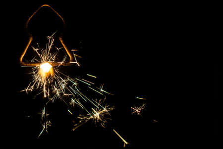 Fire sparklers on black background - Imageの写真素材