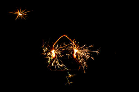 Fire sparklers on black background - Imageの写真素材