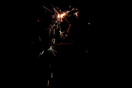Fire sparklers on black background - Imageの写真素材