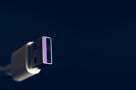 Closeup of USB cable. Isolated on black backgroundの写真素材