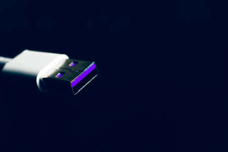 Closeup of USB cable. Isolated on black backgroundの写真素材