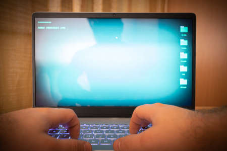 Hacker using laptop.の写真素材
