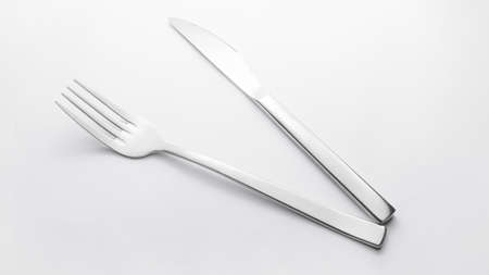 knife and fork on white backgroundの写真素材