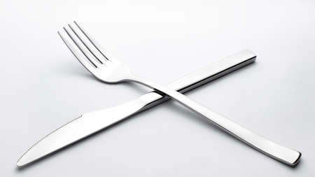 knife and fork on white backgroundの写真素材