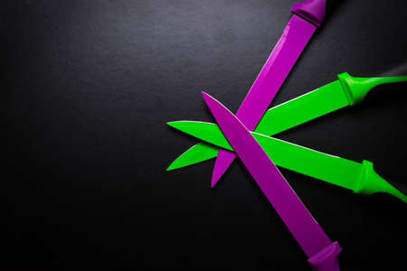 colored knives on black backgroundの写真素材