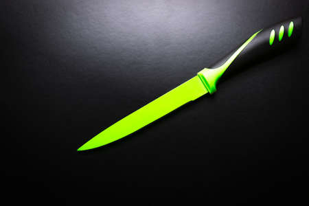 colored knives on black backgroundの写真素材