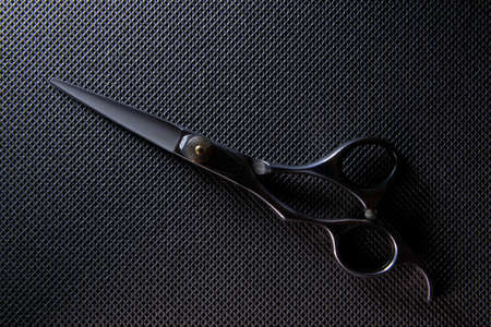 professional scissors on black background
