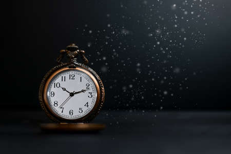 Old pocket watch on dark backgroundの写真素材