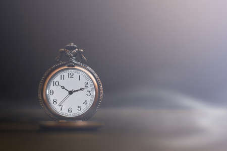 Old pocket watch on dark backgroundの写真素材