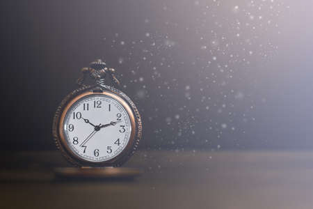Old pocket watch on dark backgroundの写真素材