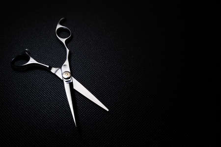 professional scissors on black backgroundの写真素材
